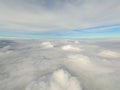 Arial view from internal cabin of aeroplane.Clouds in the sky and cityscapes though airplane window