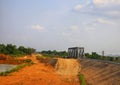 The arid ground has an iron bridge, a railway crossing in Thailand in the summer. Royalty Free Stock Photo