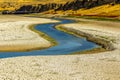 Arid and low-water rivers, dry and cracked soils on their banks Royalty Free Stock Photo