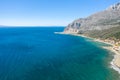 The arid rocky coast and its green countryside, in Europe, in Greece, in Aetolia Acarnania, towards Patras, by the Ionian Sea, in Royalty Free Stock Photo