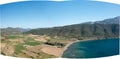 The arid rocky coast and its green countryside, in Europe, in Greece, in Aetolia Acarnania, towards Patras, by the Ionian Sea, in Royalty Free Stock Photo