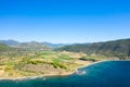 The arid rocky coast and its green countryside, in Europe, in Greece, in Aetolia Acarnania, towards Patras, by the Ionian Sea, in Royalty Free Stock Photo