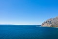 The arid rocky coast and its green countryside, in Europe, in Greece, in Aetolia Acarnania, towards Patras, by the Ionian Sea, in Royalty Free Stock Photo