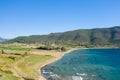 The arid rocky coast and its green countryside, in Europe, in Greece, in Aetolia Acarnania, towards Patras, by the Ionian Sea, in Royalty Free Stock Photo