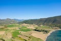 The arid rocky coast and its green countryside, in Europe, in Greece, in Aetolia Acarnania, towards Patras, by the Ionian Sea, in Royalty Free Stock Photo