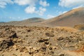 Arid volcanic landscape with lava fields in Timanfaya National Park, Lanzarote, Canary Island, Spain Royalty Free Stock Photo