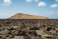 Arid volcanic landscape with lava fields in Timanfaya National Park, Lanzarote, Canary Island, Spain Royalty Free Stock Photo