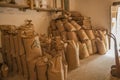 Ariege, France, 2015. Bags of freshly ground flour stacked up against wall
