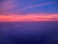 Ariel view of clouds and sky in sunset above city Royalty Free Stock Photo