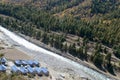 Ariel view River Stream between mountains with pine trees.Top Down view of Fast Moving Rapids River Surrounded by Pine Forest. Royalty Free Stock Photo