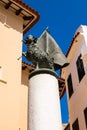 Aries with a flag on a column, Ciutatella de Menorca center Royalty Free Stock Photo