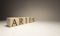 Aries word on wooden cubes on white background