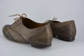 Women`s unusual gray brown shoes, shoes from genuine leather in the English style.