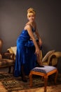 Aristocratic lady in a dark blue dress Royalty Free Stock Photo