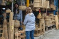 Aritao, Nueva Viscaya, Philippines - An old lady checks the wares of a local handicrafts store along the Pan- Royalty Free Stock Photo