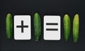 Arithmetical problems for children with cucumbers Royalty Free Stock Photo