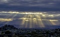 Arizona Four Peaks sunrise with sun beam rays from clouds