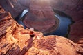 Arizona Horseshoe Bend of Colorado River in Grand Canyon. Young woman enjoying view of Horseshoe bend, Arizona. Royalty Free Stock Photo