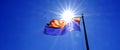 Arizona State Flag Flying on Flagpole with Sunshine Sunstar in Sky Royalty Free Stock Photo