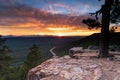 Arizona Sunset, Mogollan Rim. Orange clouds, blue sky, forest in distance. Royalty Free Stock Photo