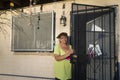 Arizona - tucson - woman in front his home