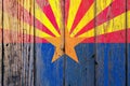 Arizona US state national flag on a gray wooden boards background on the day of independence in different colors of blue red and Royalty Free Stock Photo