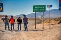 ARIZONA, USA - JUNE 19, 2018: Happy tourists at Arizona and Nevada border along a major road