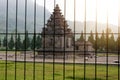 Arjuna and Semar temples behind a black metal gate Royalty Free Stock Photo