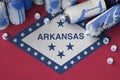 Arkansas US state flag and few used aerosol spray cans for graffiti painting. Street art culture concept Royalty Free Stock Photo