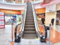 Arkhangelsk, Russia - February 28, 2024: Escalator in a Modern Shopping Mall. Big Escalator inside a vibrant shopping