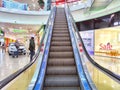 Arkhangelsk, Russia - February 28, 2024: Escalator in a Modern Shopping Mall. Big Escalator inside a vibrant shopping