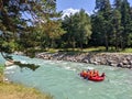 Arkhyz, Karachay-Cherkessia, Russia - August 26, 2022: Tourists go rafting. View of the Zelenchuk River in the village of Arkhyz