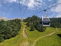 Arkhyz, Karachay-Cherkessia, Russia - August 21, 2022: View of the cable car in the resort area of Arkhyz against the backdrop of