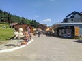 Arkhyz, Karachay-Cherkessia, Russia - August 21, 2022: View of the street with souvenir shops in the resort area of Arkhyz with