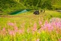 Tourists on ATV and SSV in Caucasus mountains by mountain lake Voronka. Quad bike and buggy extreme travel adventure and nature