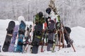 ARKHYZ, RUSSIA - FEBRUARY 9, 2022: Snowboards and skis stand at a special rack in a ski resort