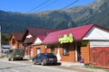 Arkhyz, Russia, Karachay-Cherkessia, September, 12, 2018. Cars on central street in the village of Arkhyz near Grocery store