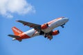 Easyjet, Airbus A319 - 111 take off in white clouds and blue sky Royalty Free Stock Photo