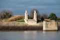 Arles, Provence, France, Banks of the River Rhone and historical monuments against dark clouds