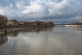 Arles, Provence, France, View over the River Rhone and the banks of the village with historical buildings Royalty Free Stock Photo