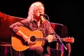 Arlo Guthrie talks with his audience during a live concert