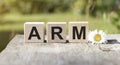 ARM - acronym from wooden blocks with letters,
