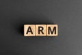 ARM - acronym from wooden blocks with letters