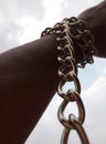 An arm with a chain twist. Concept of leadership and determination
