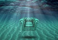 Arm chair floats in sea bottom