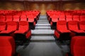 Arm-chairs and gangway are in empty hall