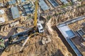 Arm of concrete pump ready for concrete conveying at construction site. Jib of concrete pump truck against sky at background. Royalty Free Stock Photo