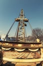 Arm of crane. Yellow boom of an old crane on a blue sky background.