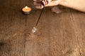 Arm of dowser with hand-held pendulum on a chain with a natural crystal Royalty Free Stock Photo