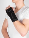 Arm orthosis. Broken wrist concept. Cast broken arm and wrist for immobilize after arm and hand injury. Man using Thumb